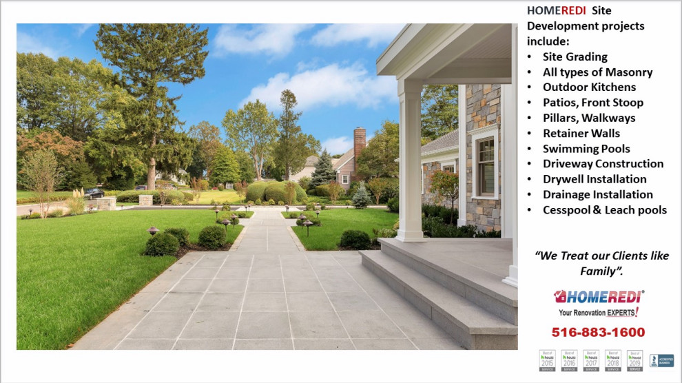 Inspiration for an expansive front driveway full sun garden in New York with natural stone paving.