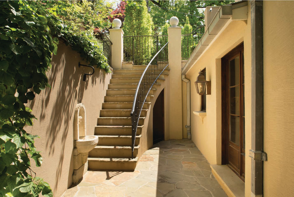 Photo of a mediterranean courtyard garden steps in DC Metro with natural stone paving.