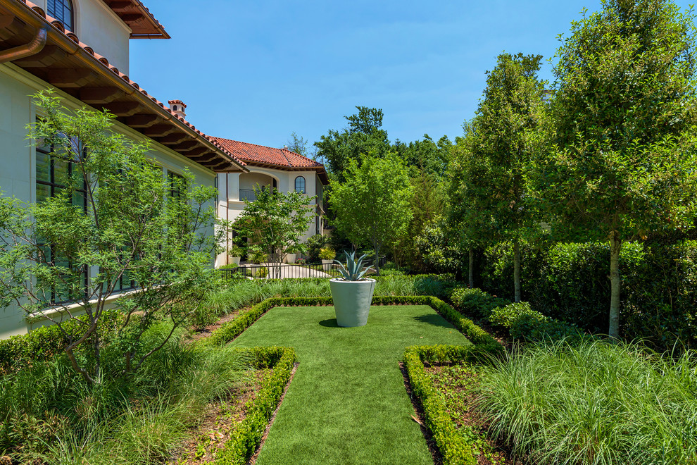 Design ideas for a huge mediterranean backyard stone landscaping in Dallas.