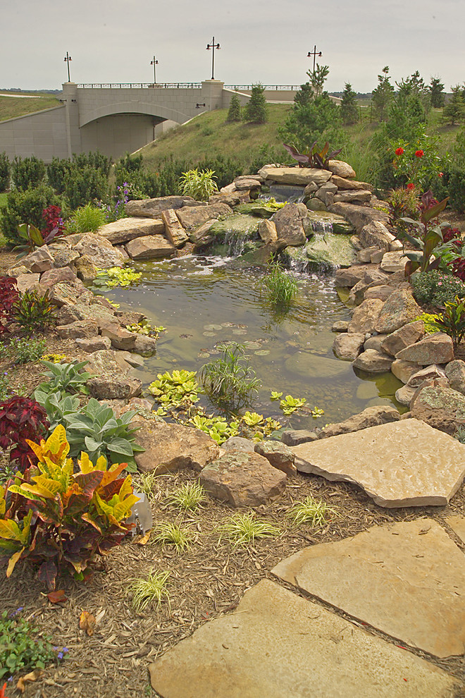 Design ideas for a huge mediterranean courtyard stone water fountain landscape in Omaha.
