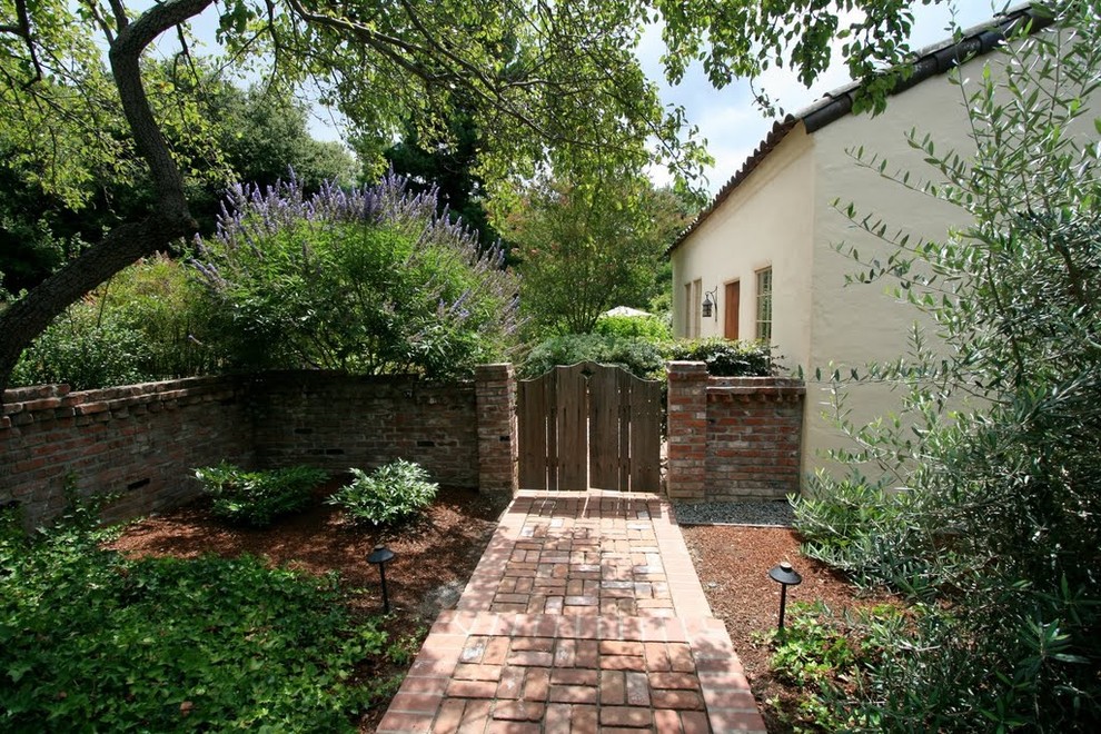 Design ideas for a mediterranean side yard landscaping in Other.