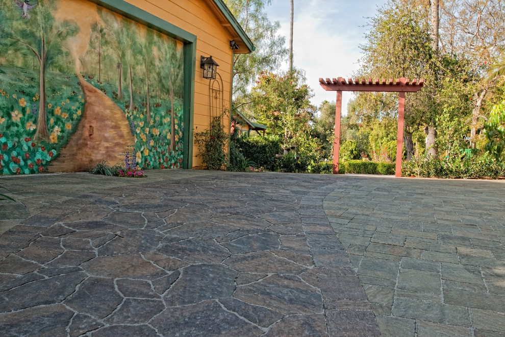 Inspiration for a mid-sized backyard concrete paver landscaping in San Diego.