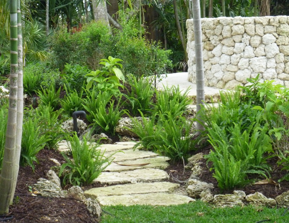 Inspiration for a world-inspired back fully shaded garden in Miami.