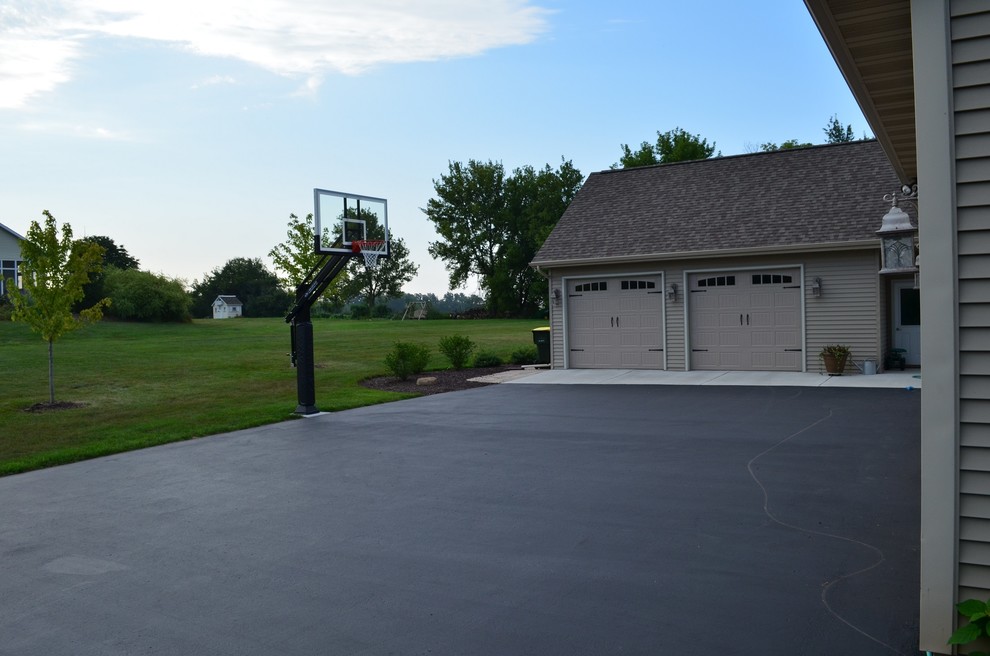 Photo of a large traditional partial sun front yard outdoor sport court in Milwaukee.