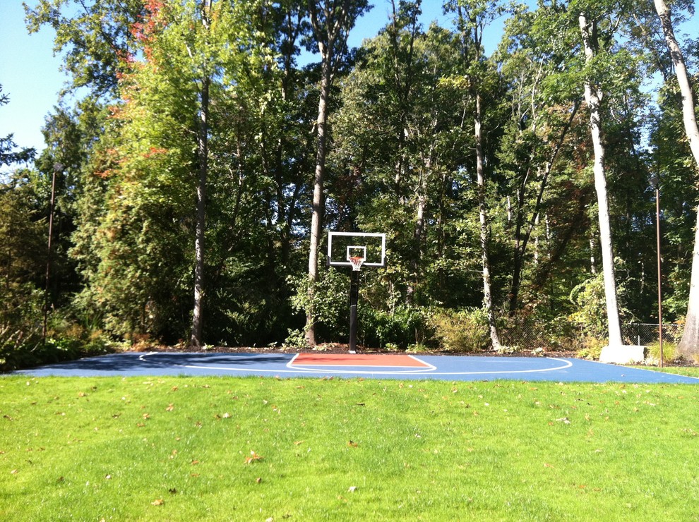 Photo of a large classic back partial sun garden in Sacramento with an outdoor sport court.