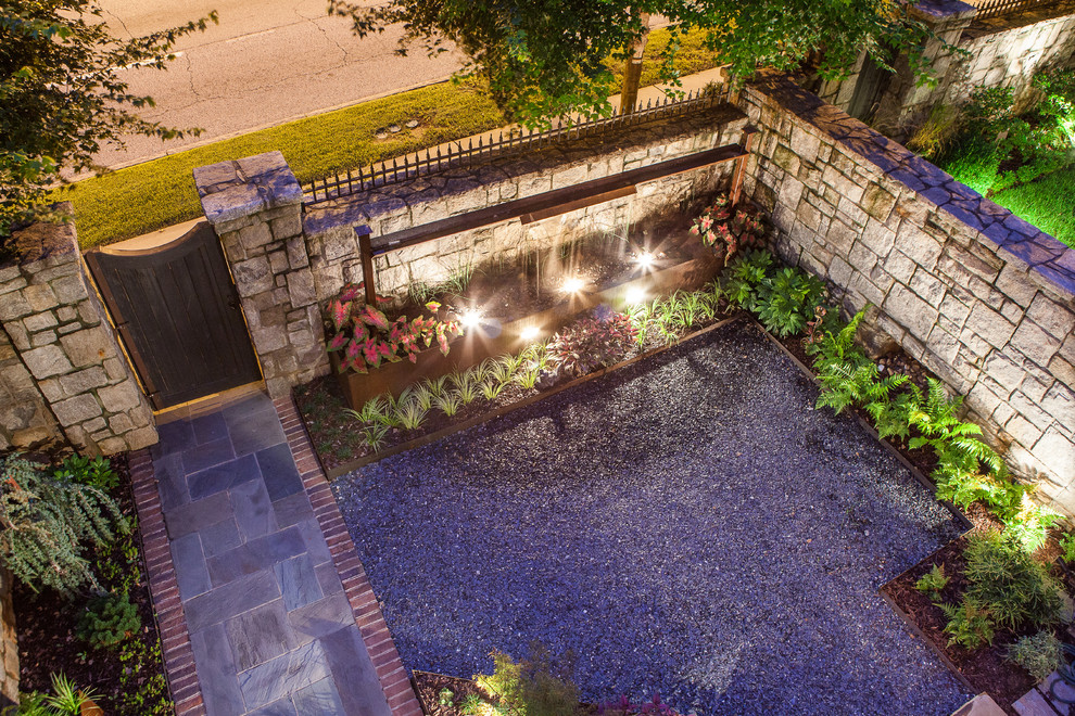 Inspiration for a small contemporary courtyard gravel water fountain landscape in Atlanta.