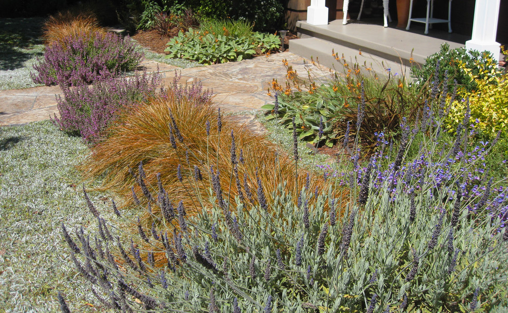 Photo of a mid-sized mediterranean full sun and drought-tolerant front yard stone garden path in San Francisco for summer.