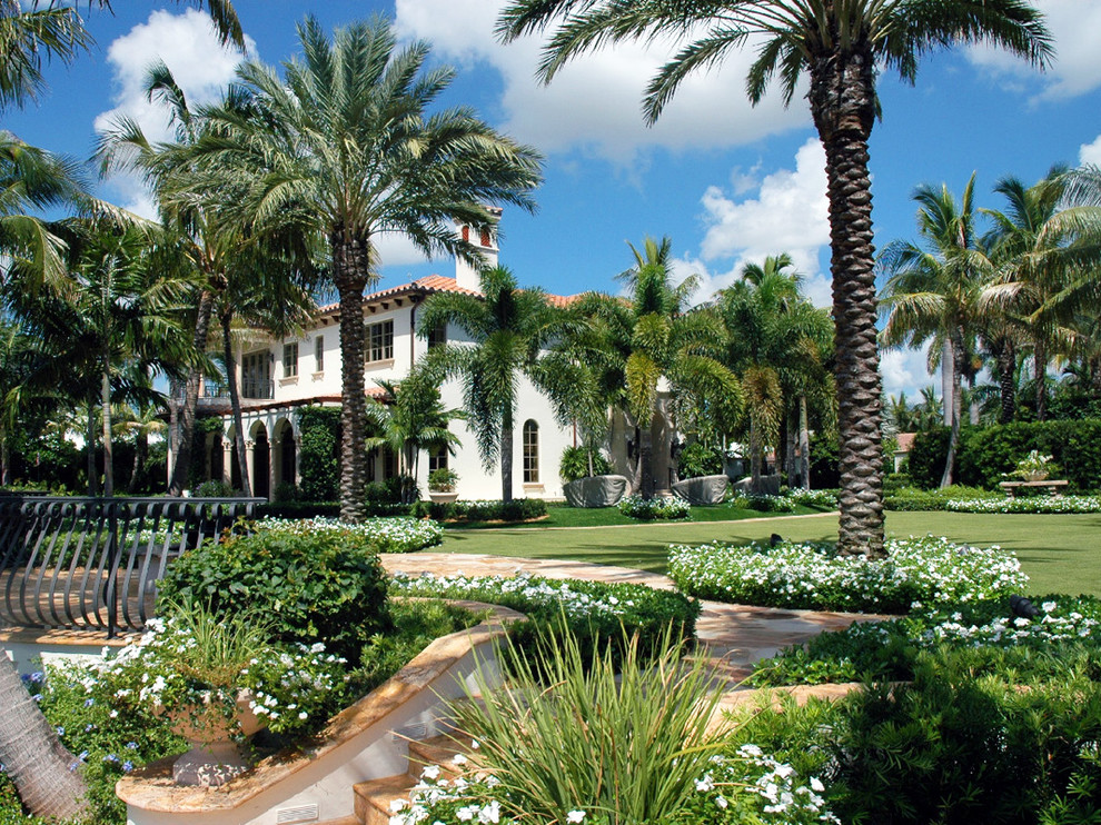 This is an example of a huge tropical full sun backyard stone garden path in Miami for summer.
