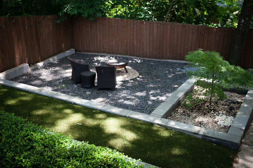 Inspiration for a mid-sized contemporary partial sun backyard gravel retaining wall landscape in Atlanta for summer.