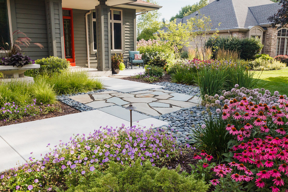 This is an example of a mid-sized asian drought-tolerant and full sun courtyard stone garden path in Milwaukee for summer.