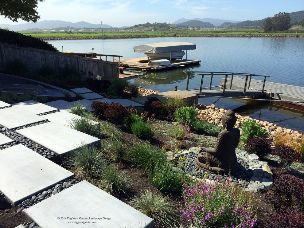 This is an example of a huge contemporary full sun backyard concrete paver landscaping in San Francisco for summer.