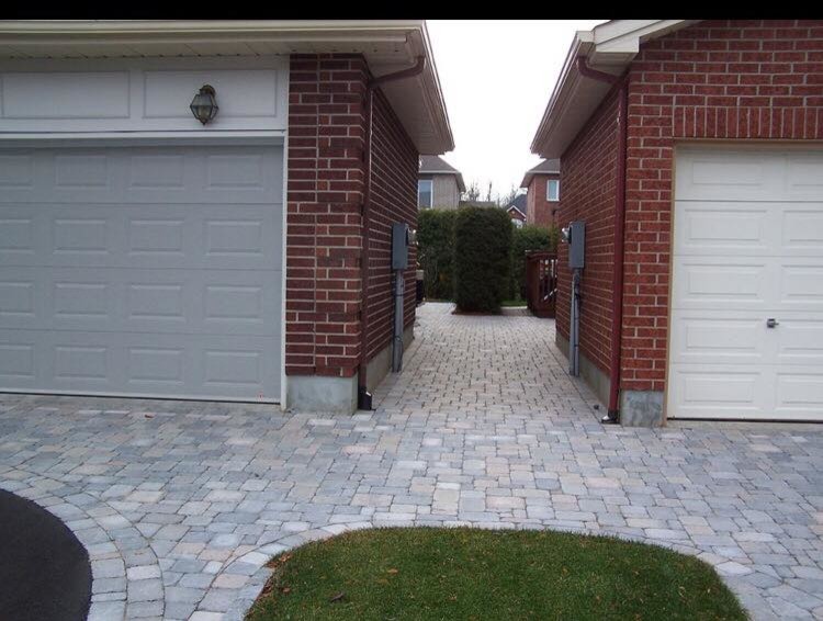 This is an example of a medium sized traditional side full sun garden in Toronto with natural stone paving.