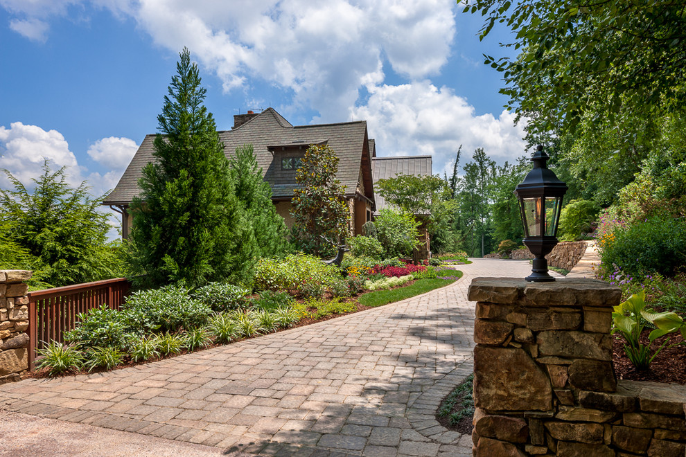 This is an example of a rustic front driveway garden in Other.