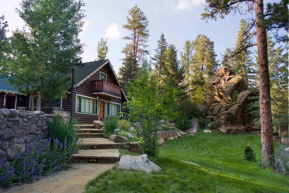 Photo of a rustic front yard stone landscaping in Denver for summer.