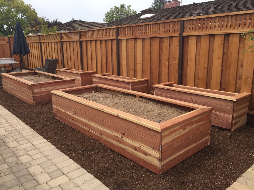 Photo of a mid-sized traditional full sun backyard brick landscaping in San Francisco for spring.