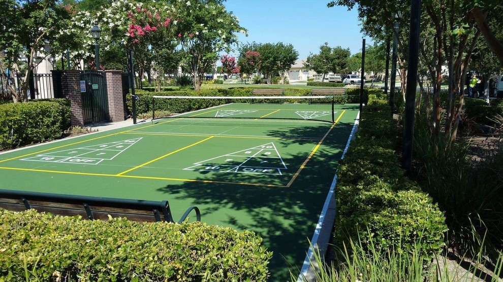 Photo of a large traditional backyard outdoor sport court in Other.