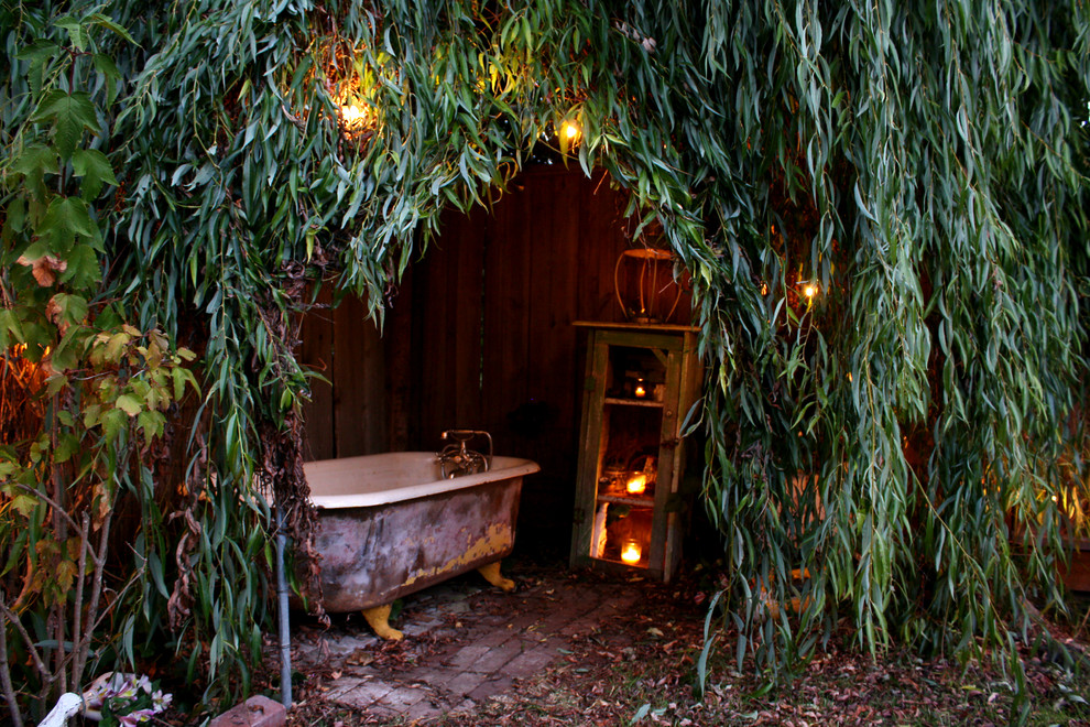 This is an example of a shabby-chic style backyard brick landscaping in San Francisco.