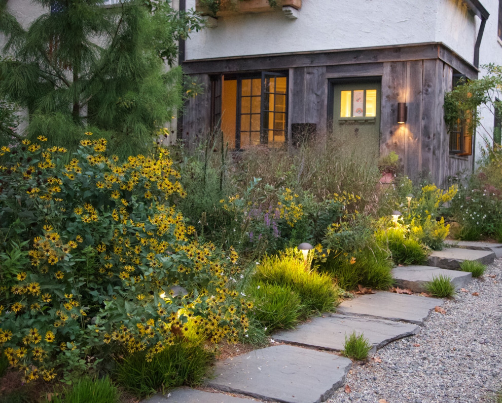 Inspiration for a small farmhouse full sun front yard stone flower bed in Philadelphia.
