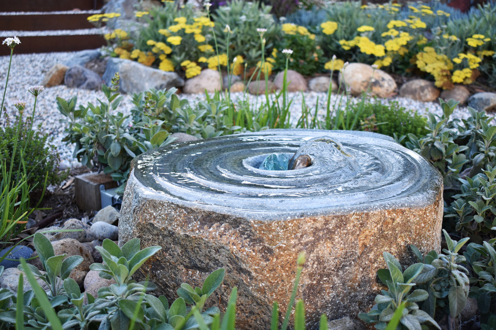 Inspiration for a mid-sized coastal drought-tolerant and full sun backyard stone water fountain landscape in San Diego for winter.