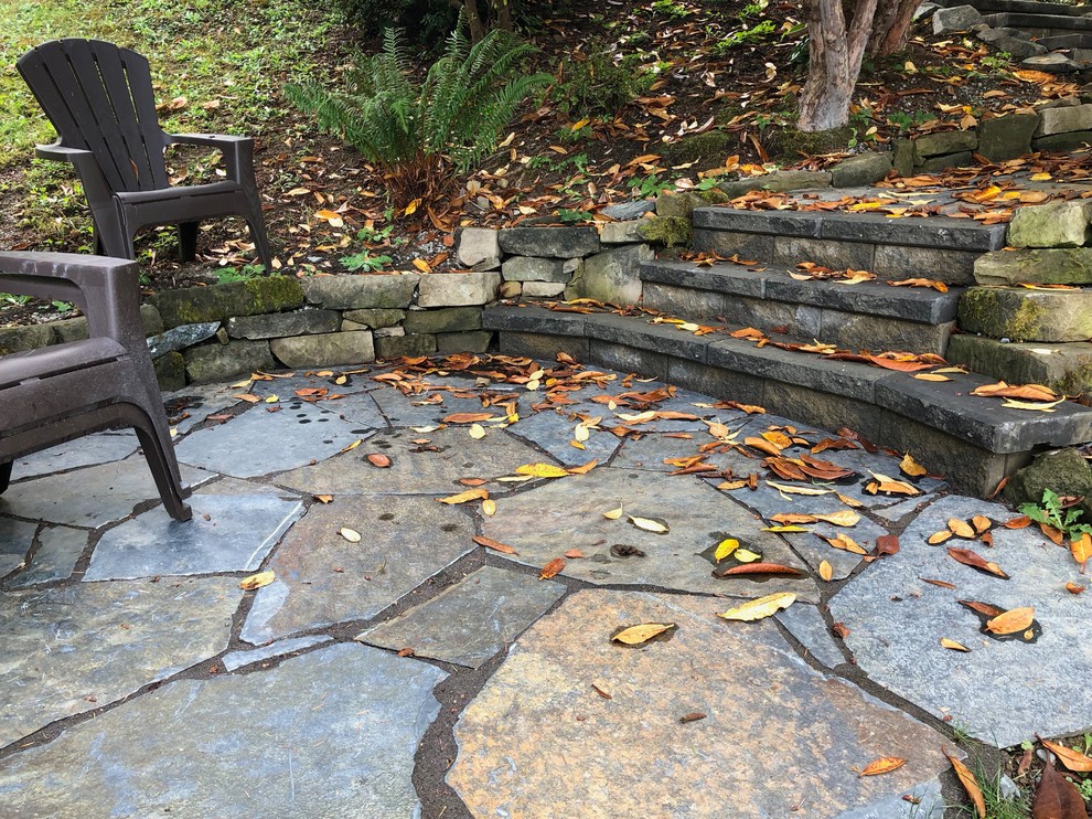 Medium sized classic back partial sun garden in Seattle with natural stone paving.
