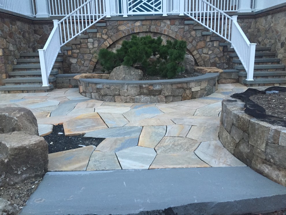 Inspiration for a beach style front garden in New York with natural stone paving.