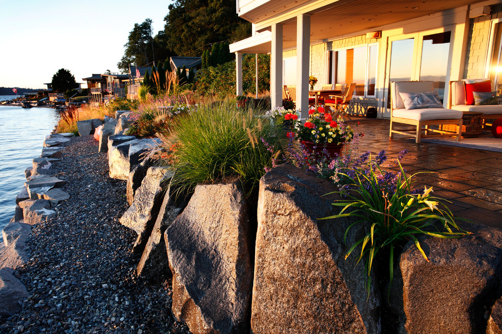 Design ideas for a backyard gravel retaining wall landscape in Seattle.