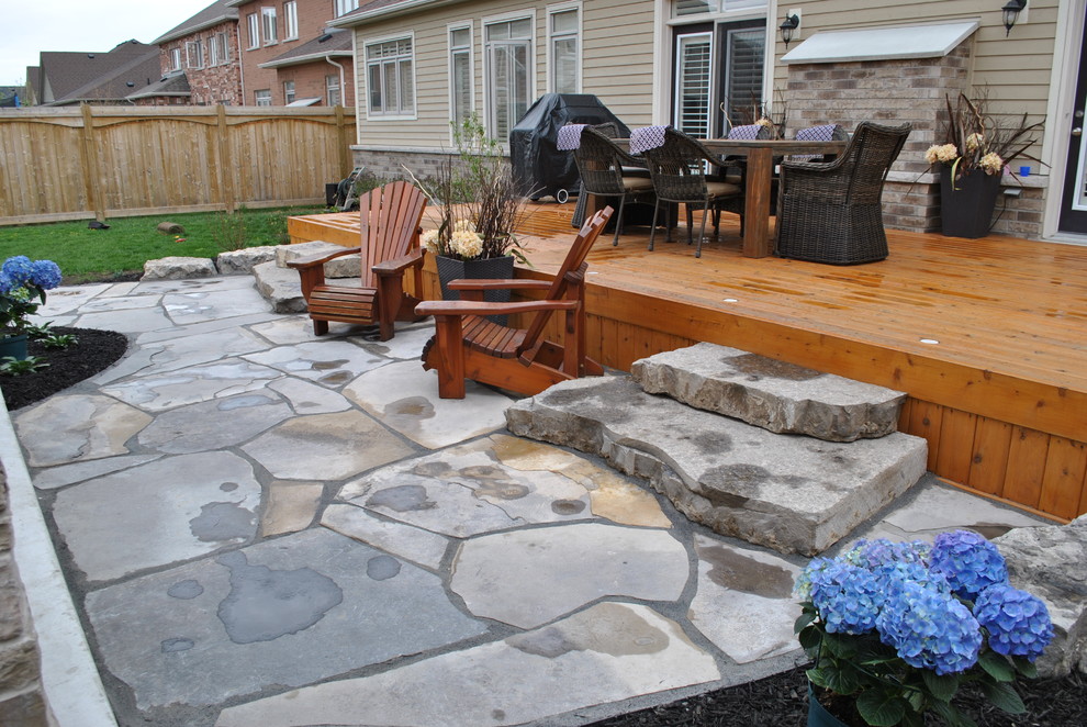 Inspiration for a contemporary back garden in Toronto with natural stone paving.