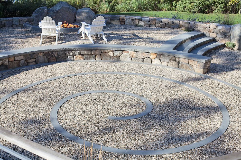 Design ideas for a mid-sized traditional drought-tolerant and full sun backyard gravel landscaping in New York with a fire pit for summer.