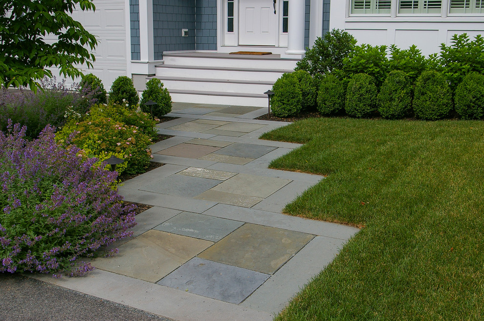 Small traditional front full sun garden in Boston with natural stone paving.