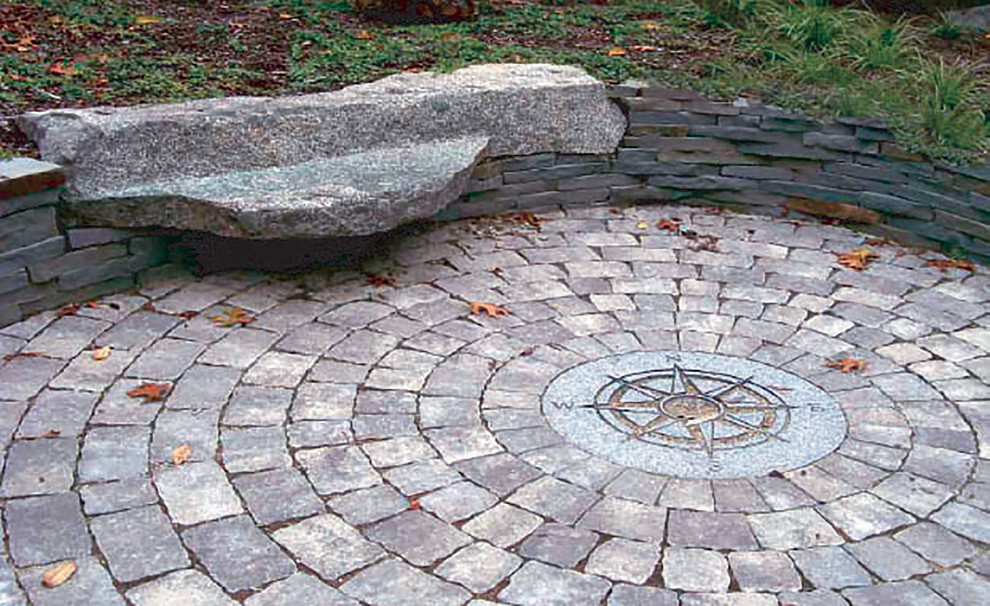 Photo of a mid-sized traditional full sun front yard stone landscaping in Boston for summer.