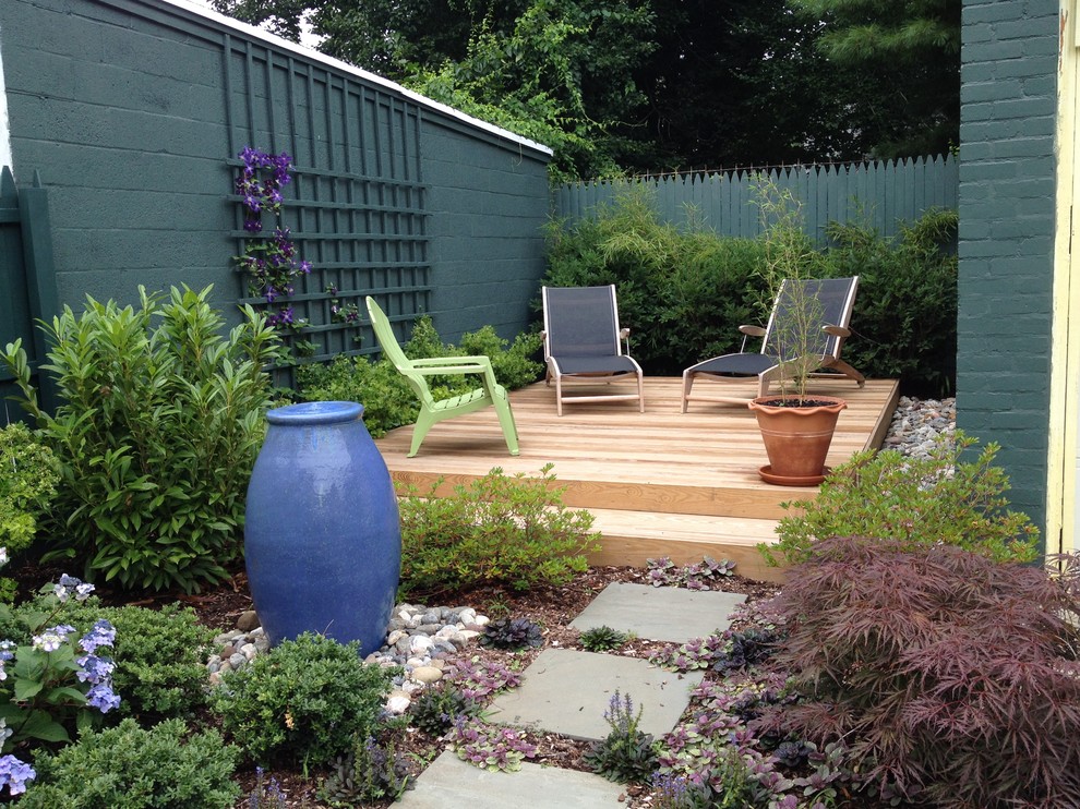 Small contemporary back full sun garden for summer in Bridgeport with a water feature and decking.