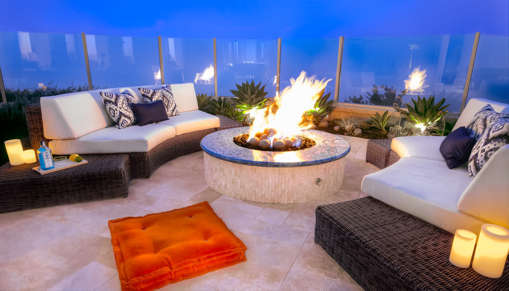 Design ideas for a medium sized contemporary back patio in Orange County with a fire feature and natural stone paving.