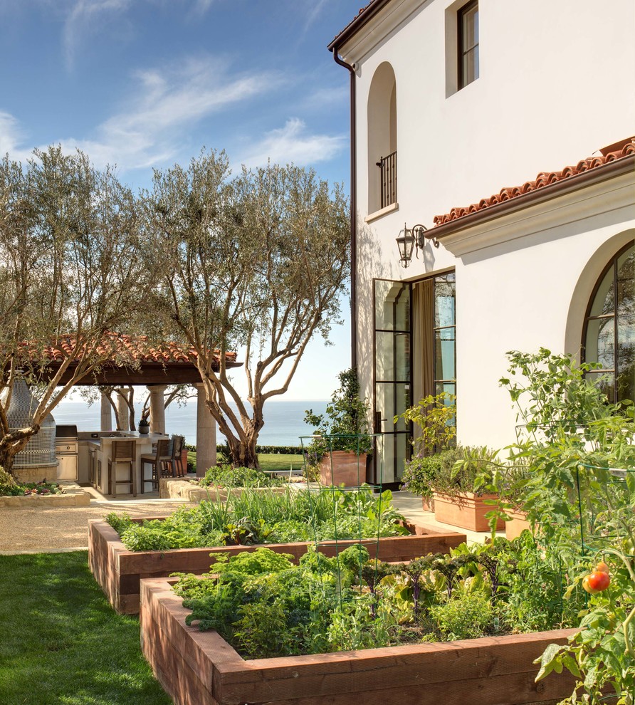 Design ideas for a mediterranean garden in Orange County with a vegetable patch.