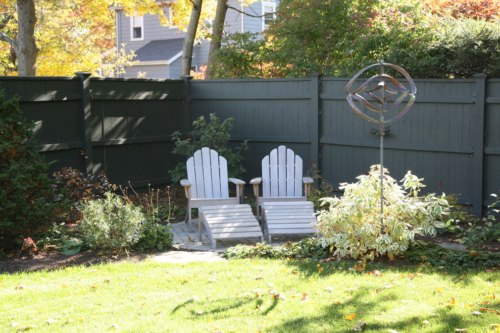 Photo of a mid-sized eclectic partial sun backyard concrete paver garden path in Boston for fall.