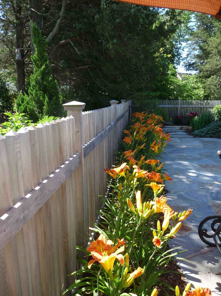 Photo of a traditional partial sun backyard stone garden path in Bridgeport for summer.
