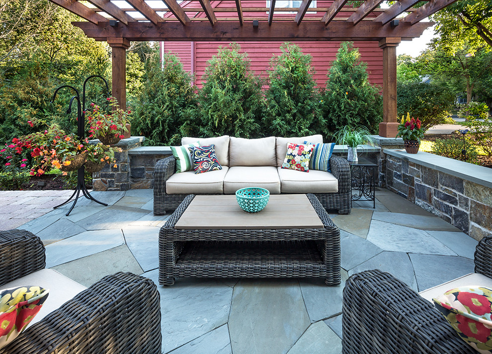 Example of a mid-sized mountain style courtyard stone patio design in Chicago