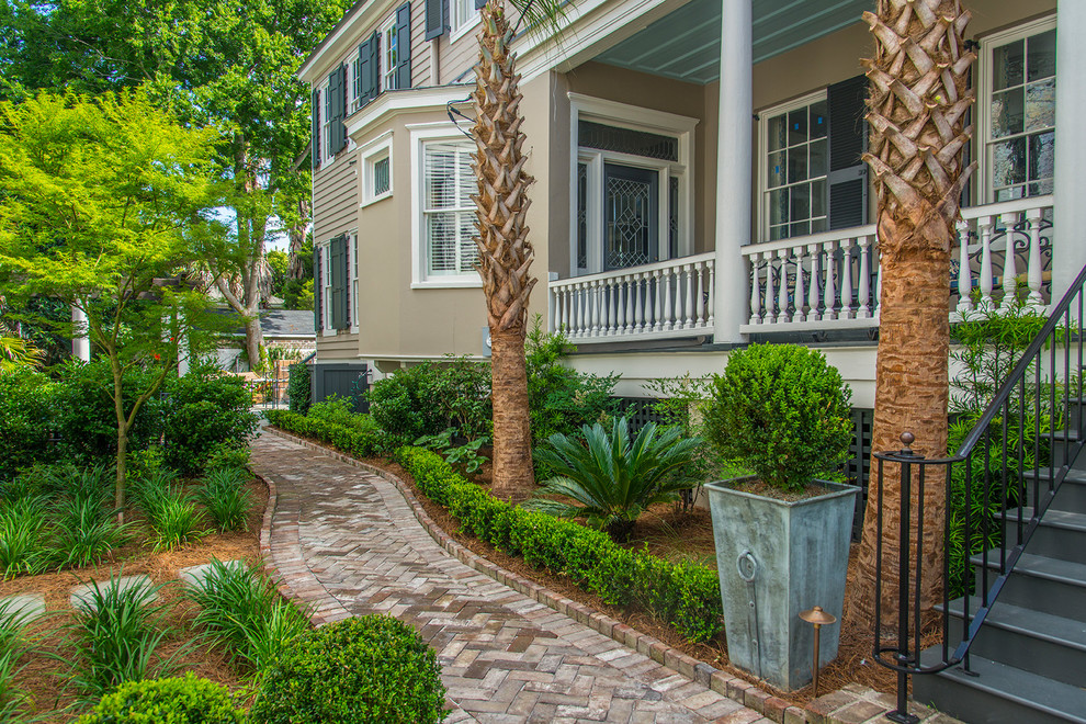 Inspiration for a medium sized traditional front formal partial sun garden in Charleston with a garden path and brick paving.