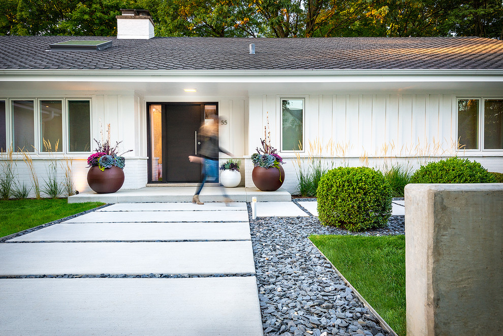 Medium sized contemporary front garden in Chicago with a garden path and concrete paving.