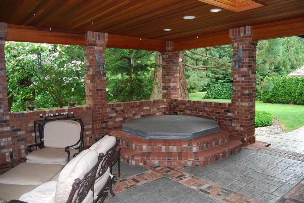 Photo of a large traditional back garden in Seattle with a potted garden and brick paving.