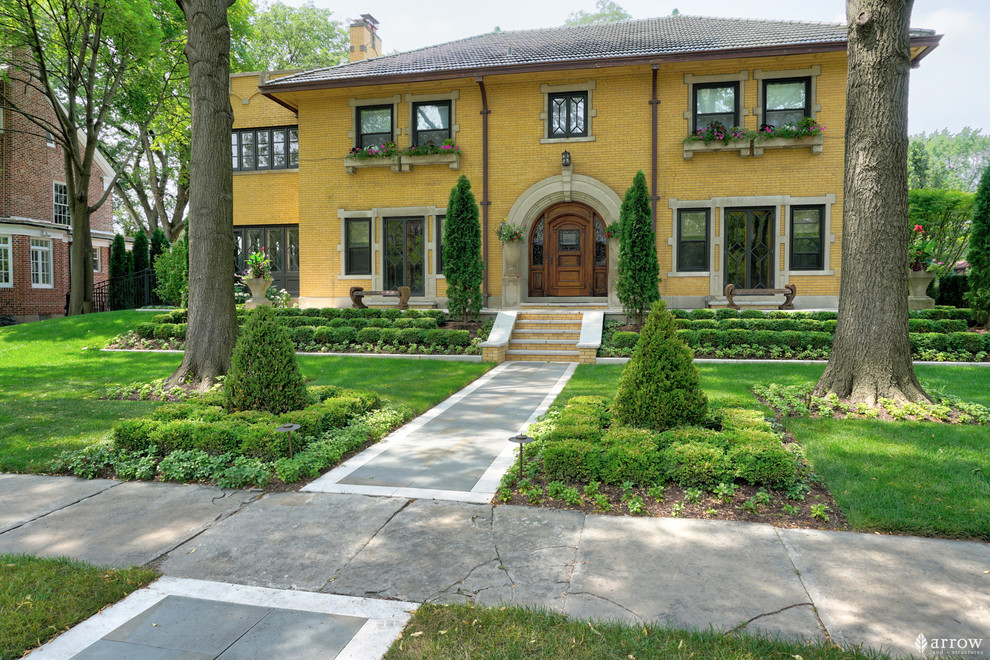 Ispirazione per un grande giardino formale vittoriano esposto a mezz'ombra davanti casa in estate con un ingresso o sentiero e pavimentazioni in pietra naturale