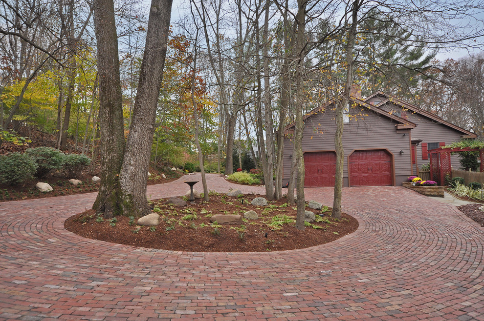 Photo of a traditional front driveway garden in Newark with brick paving.