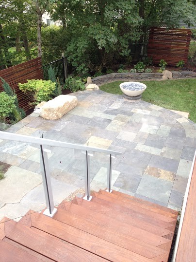 Design ideas for a modern back formal garden in Other with natural stone paving.