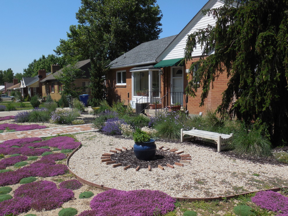 Inspiration for a small eclectic front xeriscape full sun garden for summer in Salt Lake City with a garden path and gravel.