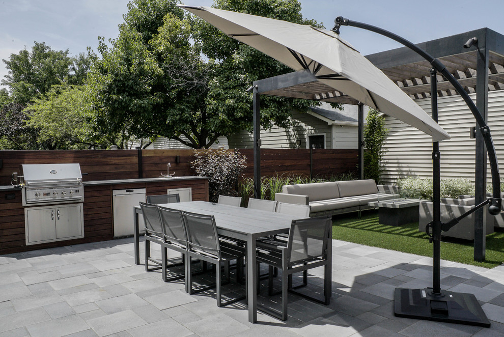 Patio - mid-sized modern backyard concrete paver patio idea in Chicago with a fire pit