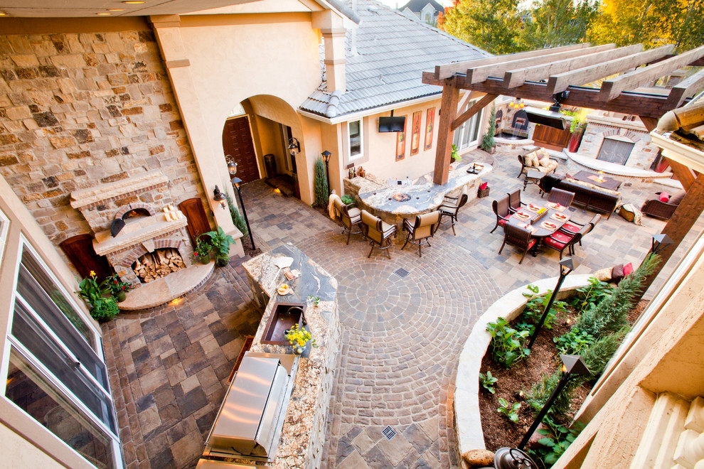 Inspiration for a large mediterranean courtyard fully shaded garden in Denver with concrete paving.