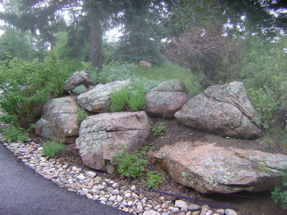 Inspiration for a large traditional full sun front yard stone landscaping in Denver for spring.