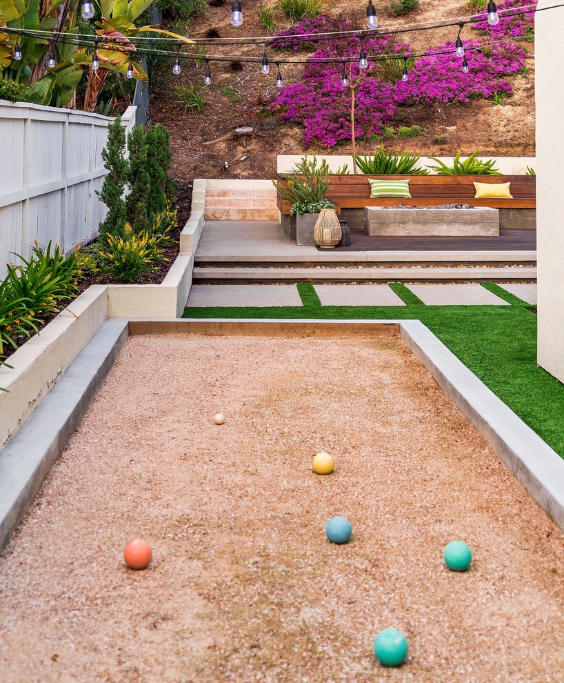 Inspiration for a medium sized contemporary back full sun garden for spring in San Diego with concrete paving.