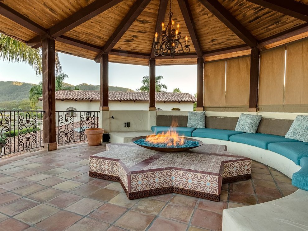 Design ideas for a large mediterranean shade backyard landscaping in San Luis Obispo with a fire pit.