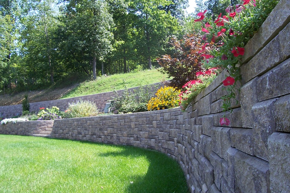 Inspiration for a large back garden in Orange County with a retaining wall.