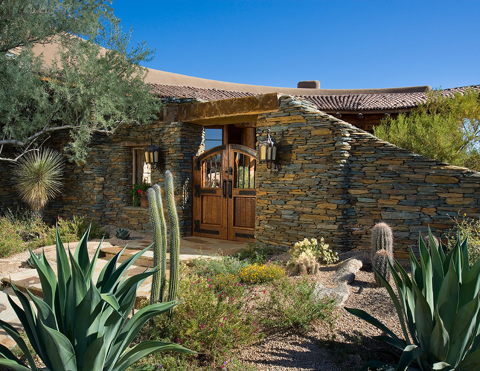 Design ideas for a southwestern drought-tolerant front yard stone garden path in Phoenix.